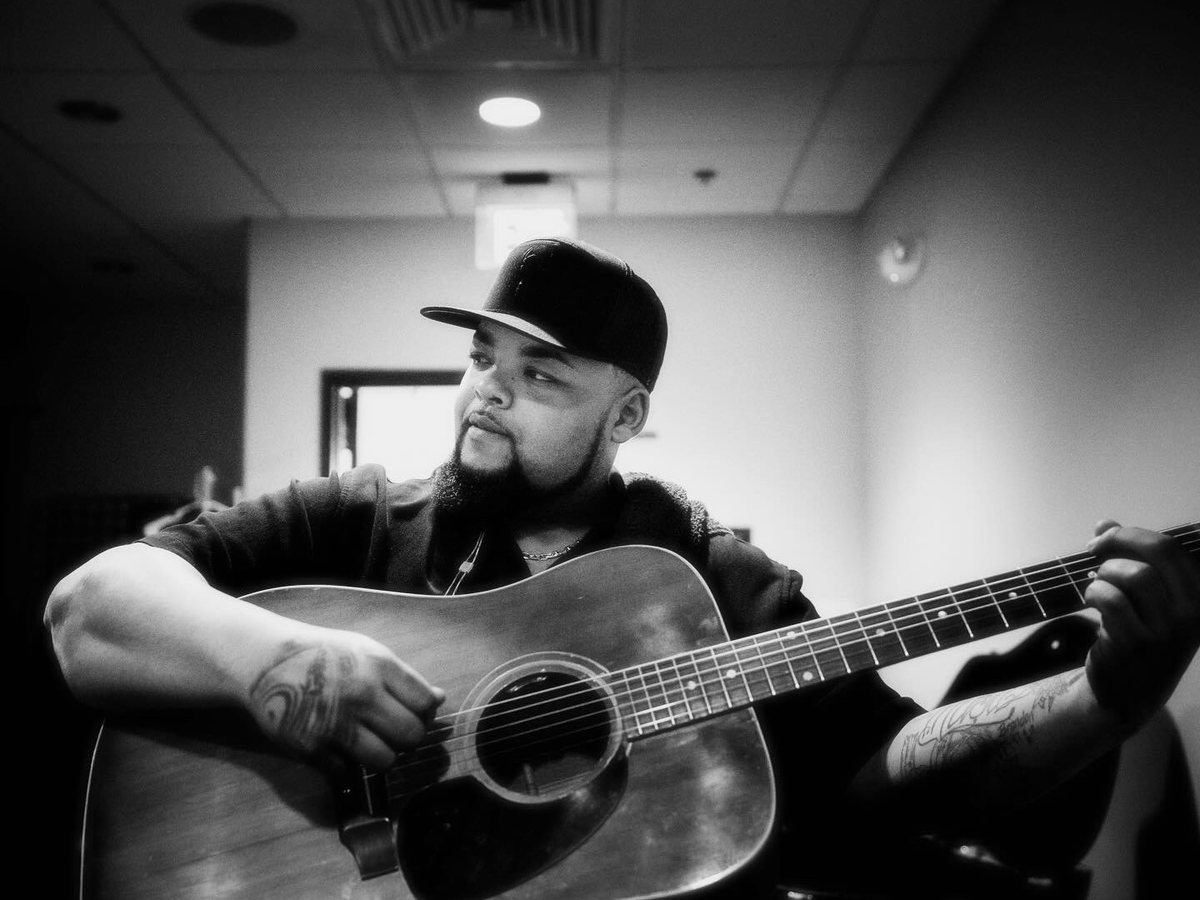 Dalton Dover playing acoustic guitar